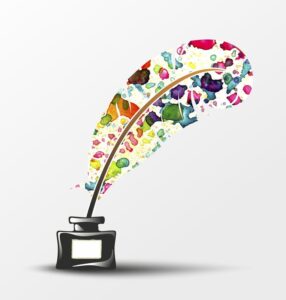 feather with colorful squirts stuck into an inkwell
